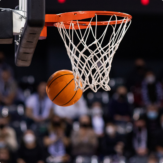 Close-up of basketball and basketball hoop