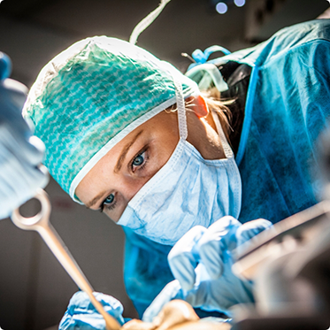 Close up of dentist with mask during procedure