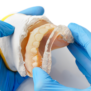 Taking occlusal splint off model of teeth