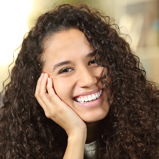 Woman showing off new smile with veneers