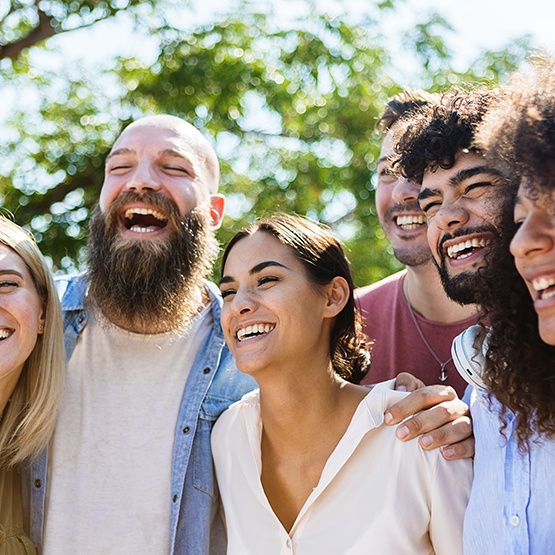  Patient in Phoenix smiling with friends after teeth whitening